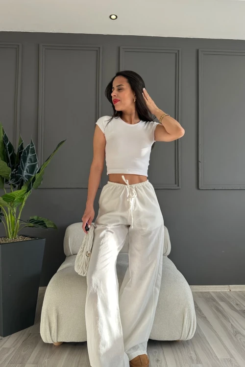 Kadın Beyaz Cepli Beli Lastikli Bol Paça Keten Pantolon HZL24S-ZK11051